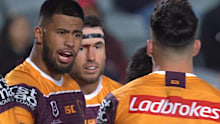 Broncos prop Payne Haas blasts captain Alex Glenn over a Warriors try.