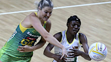 Australia's Gretel Tippett (L) and Zimbabwe's Felisitus Kwangwa battle for the ball.