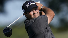 Patrick Reed hits a tee shot during the third round of the Farmers Insurance Open.