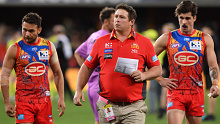 Gold Coast Suns coach Stuart Dew (C).