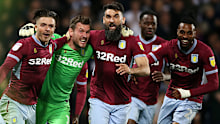The Socceroos captain celebrates with his Villa teammates.