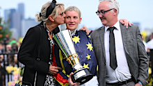 Jamie Kah poses with parents John and Karen after riding Goldrush Guru to win the Penfolds Victoria Derby.