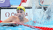 Thomas Gallagher celebrates winning gold in Paris.