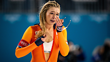 Dutch speed skater Jutta Leerdam celebrates her Olympic record-breaking gold medal in the women's 1,000m final at Milano Cortina 2026.