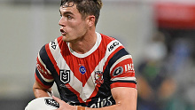 Kyle Flanagan of the Roosters runs the ball 