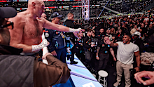Tyson Fury exchanges words with Anthony Joshua after his fight at Tottenham Hotspur Stadium on April 11