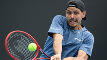 Australia's Alex Bolt makes a forehand return to Slovakia's Norbert Gombos during their first round match at the Australian Open tennis championship in Melbourne, Australia, Monday, Feb. 8, 2021.(AP Photo/Andy Brownbill)
