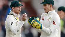 Steve Smith and Tim Paine discuss tactics during the Ashes.
