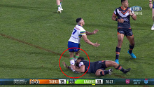 Isaiah Papali'i crashes into Jamal Fogarty's legs.