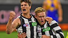 Brody Mihocek and Jaidyn Stephenson of the Magpies celebrates a goal late in the game 