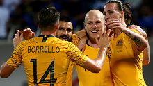 Aaron Mooy (2R) celebrates his goal against Kuwait.