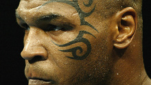 Mike Tyson and his infamous face tattoo before his 2003 fight against Clifford Etienne.