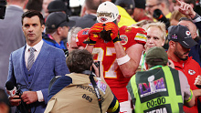 Travis Kelce pulls down his hat in an emotional reaction to the Chiefs' Super Bowl victory.