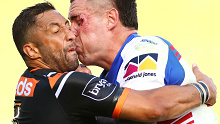 Wests Tigers five-eighth Benji Marshall tackles Knights prop David Klemmer during NRL Round 2.