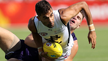 Carlton recruit Jack Martin takes on Fremantle's Luke Ryan during an AFL pre-season match.