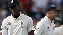 Jofra Archer and Joe Root during Australia's second innings at Old Trafford.