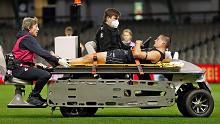 Nic Newman of the Blues leaves the field on a stretcher 