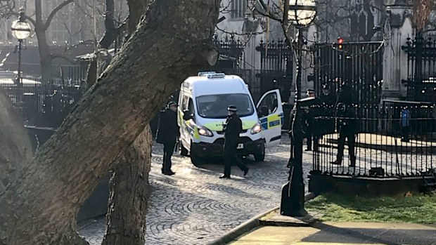 Armed police at London's Houses of Parliament after a man is tasered and arrested inside the Palace of Westminster.