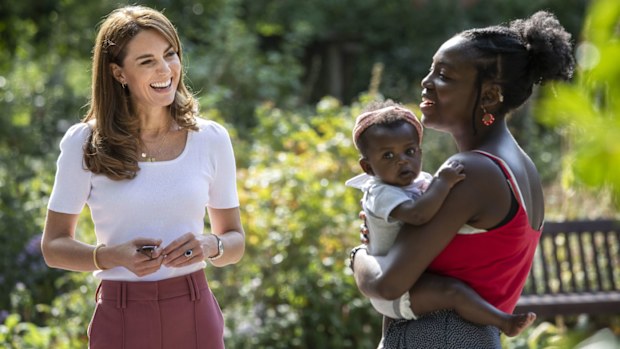 Kate Middleton, Duchess of Cambridge meets with MUSH mother and baby group member, Morgan Alex Cassius and her 6 month old, Makena Grace during a visit to Battersea Park, London, Tuesday, Sept. 22, 2020