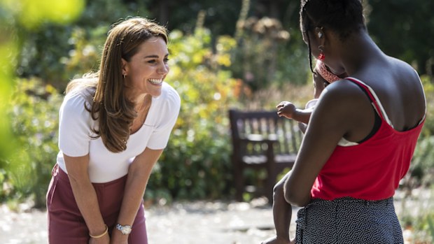 Kate Middleton, Duchess of Cambridge meets with MUSH mother and baby group member, Morgan Alex Cassius and her 6 month old, Makena Grace during a visit to Battersea Park, London, Tuesday, Sept. 22, 2020