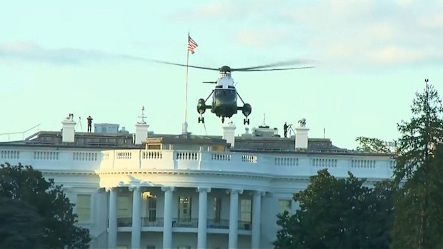 Marine One leaves the White House to take Donald Trump to hospital.