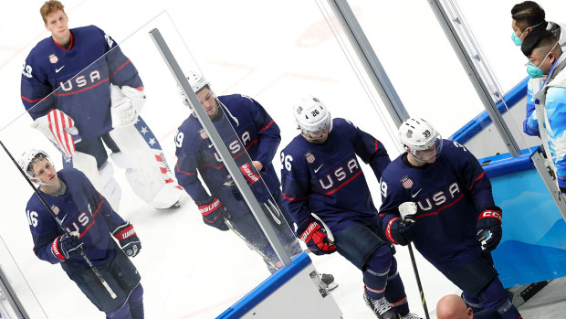 Dejected after losing the match on a penalty shootout, players of Team USA leave the ice