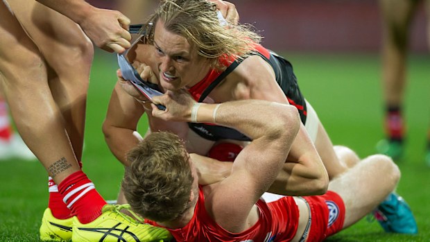 Nick Blakey of the Swans and Mason Redman of the Bombers 