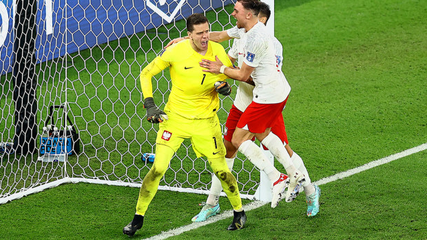 Wojciech Szczesny of Poland reacts after saving a penalty from Lionel Messi of Argentina.