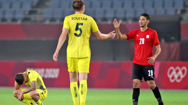 Ahmed Fotouh #20 of Team Egypt shakes hands with Harry Souttar #5 of Team Australia