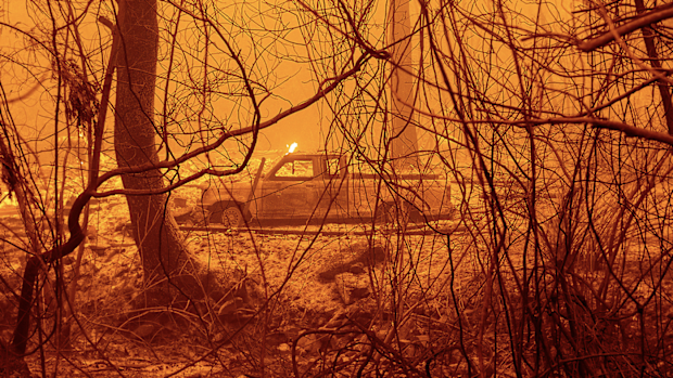 A scorched car rests in a clearing following the Bear Fire in Butte County, Calif., on Wednesday, Sept. 9, 2020. (AP Photo/Noah Berger)