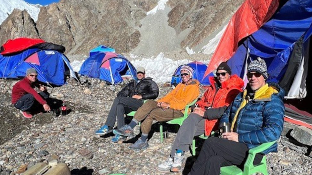 Mountaineer Dr Richard Cartier is pictured on the far right with fellow climbers on K2.