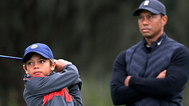 Tiger Woods watches son Charlie at the Father-Son Challenge golf tournament.