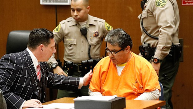 Naason Joaquin Garcia, the leader of a Mexico-based evangelical church with a worldwide membership, appears with his defense attorneys Ken Rosenfeld