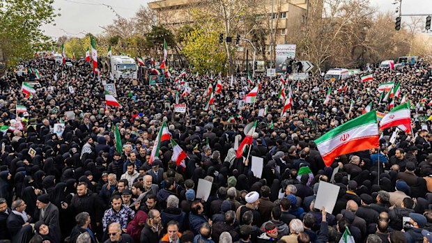 Pro-regime Iranians turn out for a funeral procession for security forces killed by protesters.