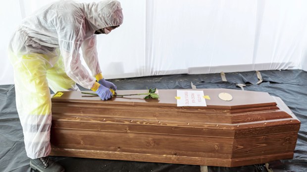 A flower is placed on the coffin of a COVID-19 victim in Italy, one of the countries hardest hit by the pandemic. 