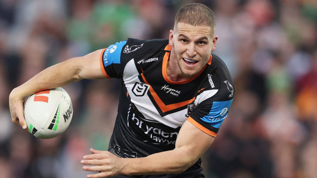 Adam Doueihi of the Tigers runs with the ball during the round 16 NRL match between Wests Tigers and Canberra Raiders at Campbelltown Stadium, on June 23, 2024, in Sydney, Australia.