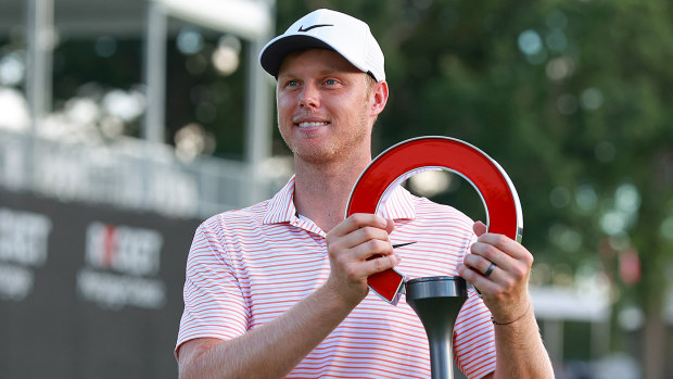 Australia's Cameron Davis holds up the trophy during the awards ceremony after winning his second consecutive Rocket Mortgage Classic at the Detroit Golf Club in Detroit, Michigan, Sunday, June 30, 2024. (Photo by Amy Remus/NurPhoto)