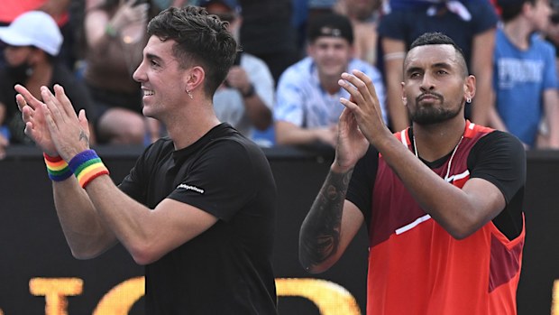 Thanasi Kokkinakis (left) and Nick Kyrgios greet an Australian Open crowd in 2022.