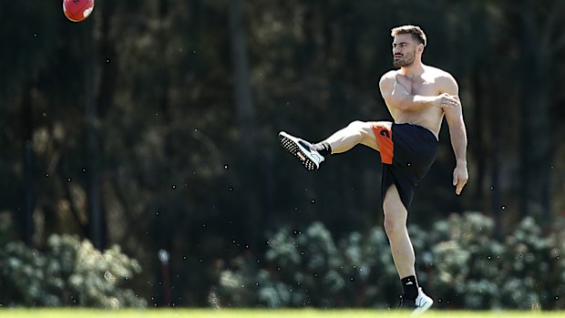 Stephen Coniglio of the Giants kicks during a Greater Western Sydney Giants AFL training session 