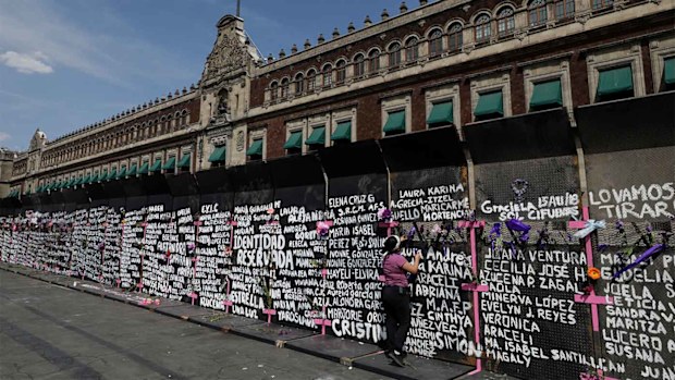 The names of murdered and missing women are written on a wall in Mexico City.