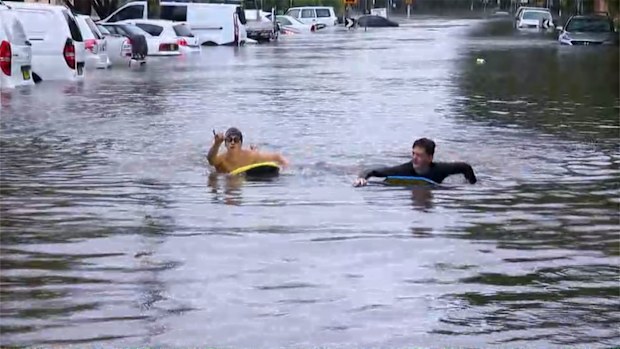 NSW weather update; floods northern beaches kids play
