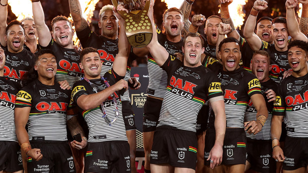 Penrith players celebrate their grand final win over Paramatta.