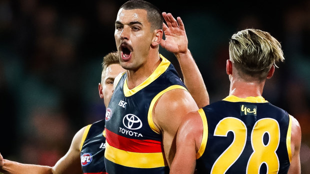 Taylor Walker of the Crows celebrates after kicking a goal 