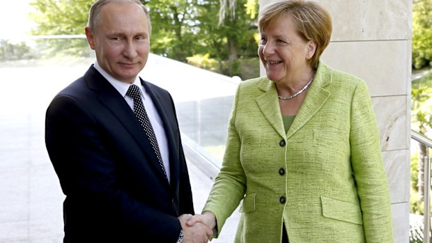 Russian President Vladimir Putin meets with German Chancellor Angela Merkel. (AAP)