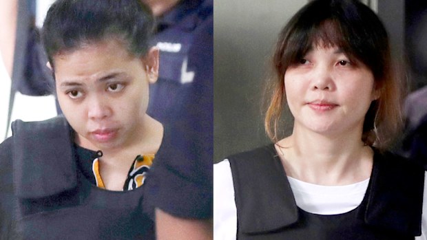 Indonesian Siti Aisyah, left, and Vietnamese Doan Thi Huong, right, are escorted by police as they leave their court hearing at Shah Alam court house in Shah Alam, outside Kuala Lumpur, Malaysia. (AP)