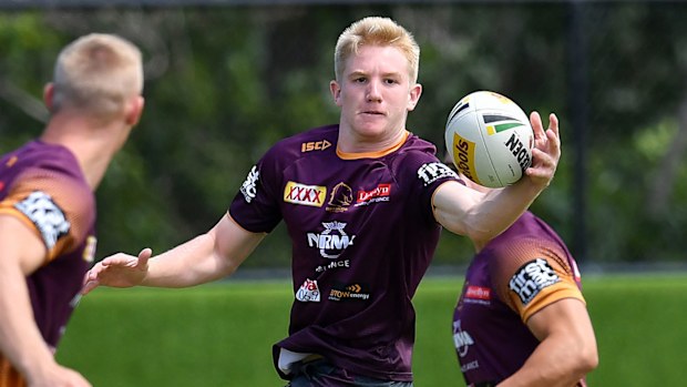 Tom Dearden (centre) in action during Brisbane Broncos training
