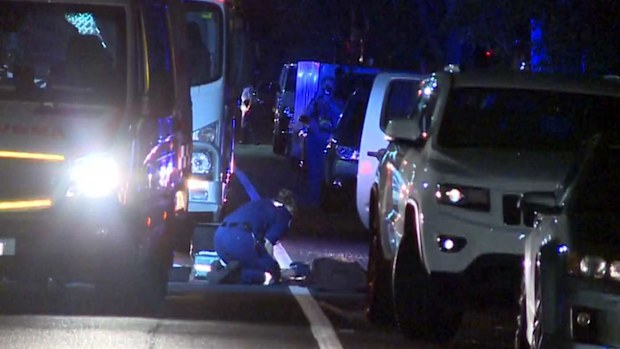 A police officer investigates the crime scene in Strathfield.