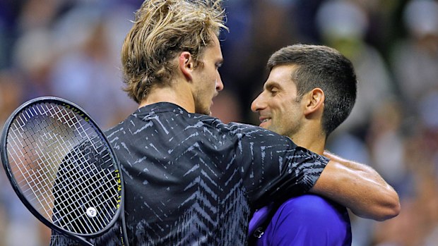 Alexander Zverev of Germany and Novak Djokovic of Serbia embrace