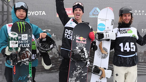 Yuto Totsuka of Japan in second place, Scotty James of Australia in first place and Pat Burgener of Switzerland in third place celebrate on the podium