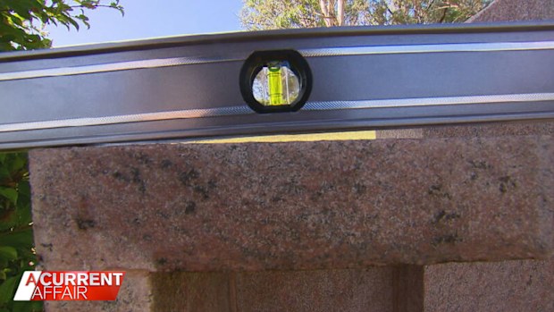 Rita Petrovic feels let down over the crooked tombstone. 